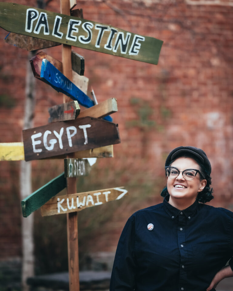 jamila hammami in dumbo, nyc, palestine, egypt. somalia, syria, and kuwait signs, Photographed by Johnny Perez, Day1Pictures
